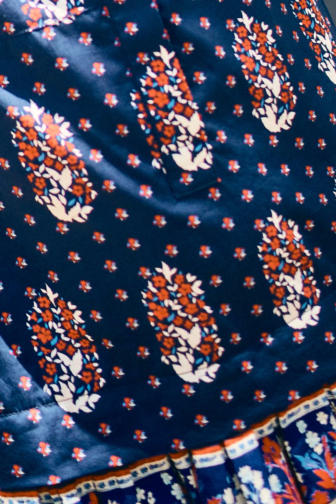 The Addison drop waist shirt dress has a crisp collar, delicate button placket in  fall floral navy.