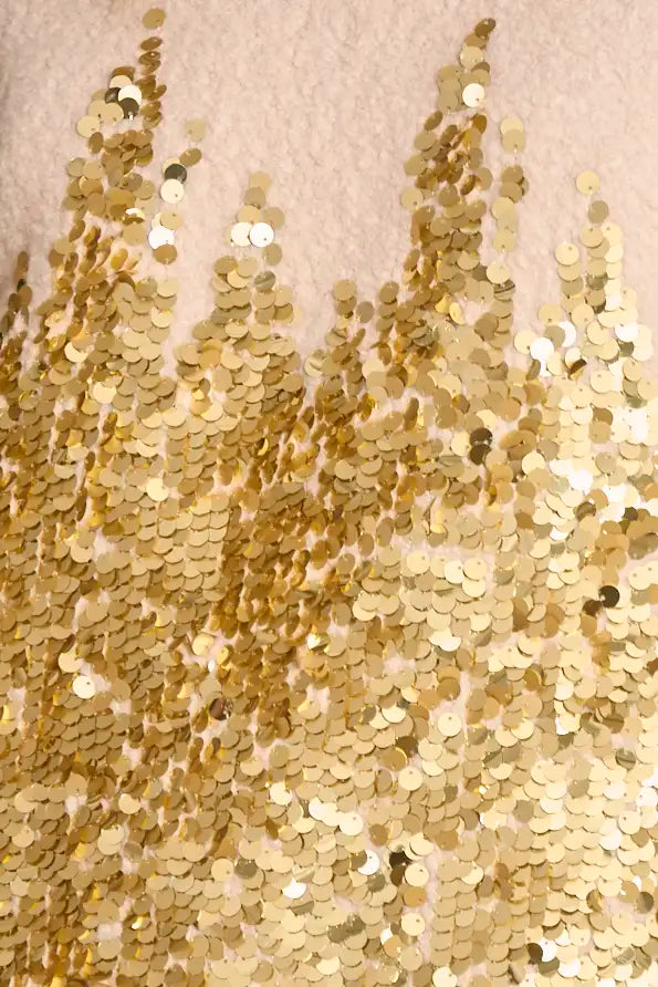 The Tinsley Coat is in our City Lights Gold Sequins Bouclé with a rounded neckline and long sleeves.