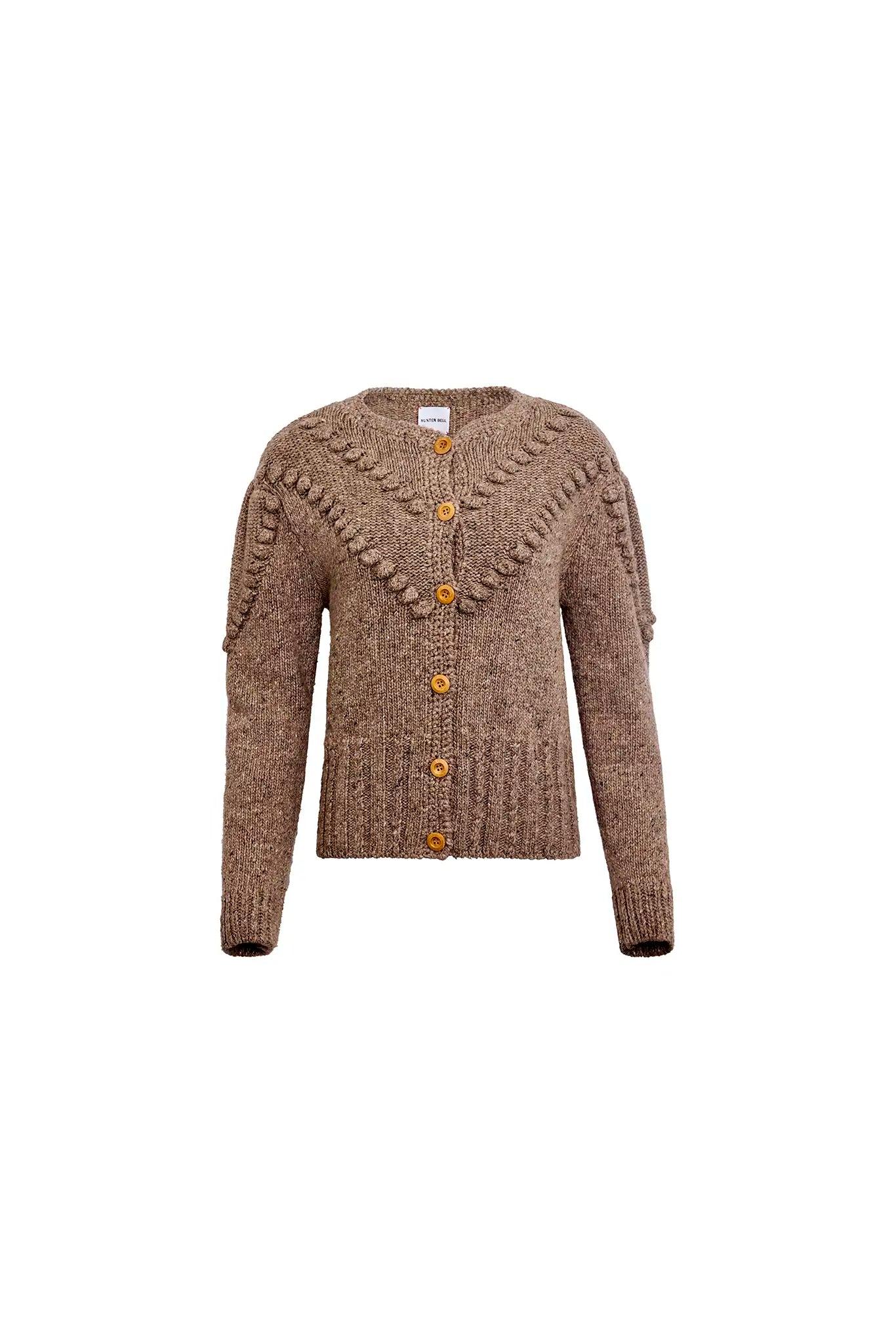 The Bobble Sweater is a crew neck style with a button-front, long sleeves and an oversized fit.