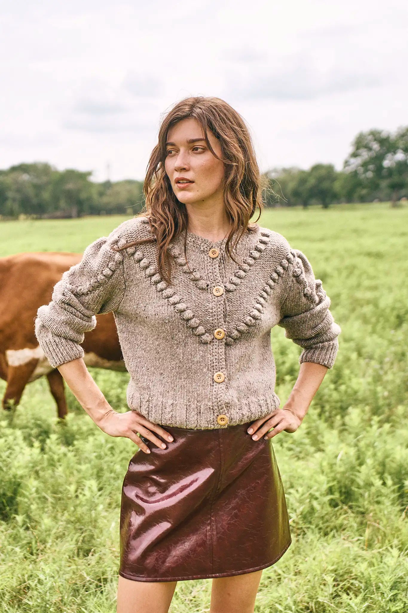 The Bobble Sweater is a crew neck style with a button-front, long sleeves and an oversized fit.