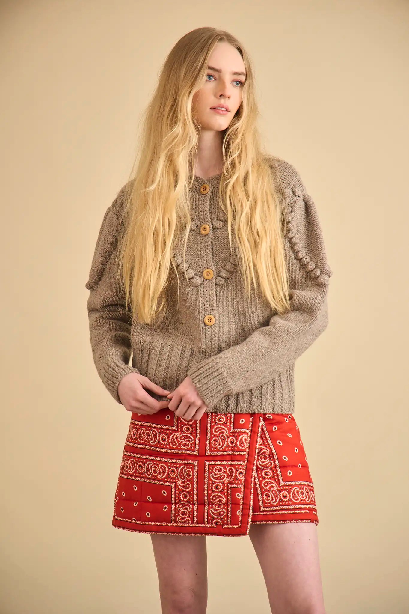 The Bobble Sweater is a crew neck style with a button-front, long sleeves and an oversized fit.