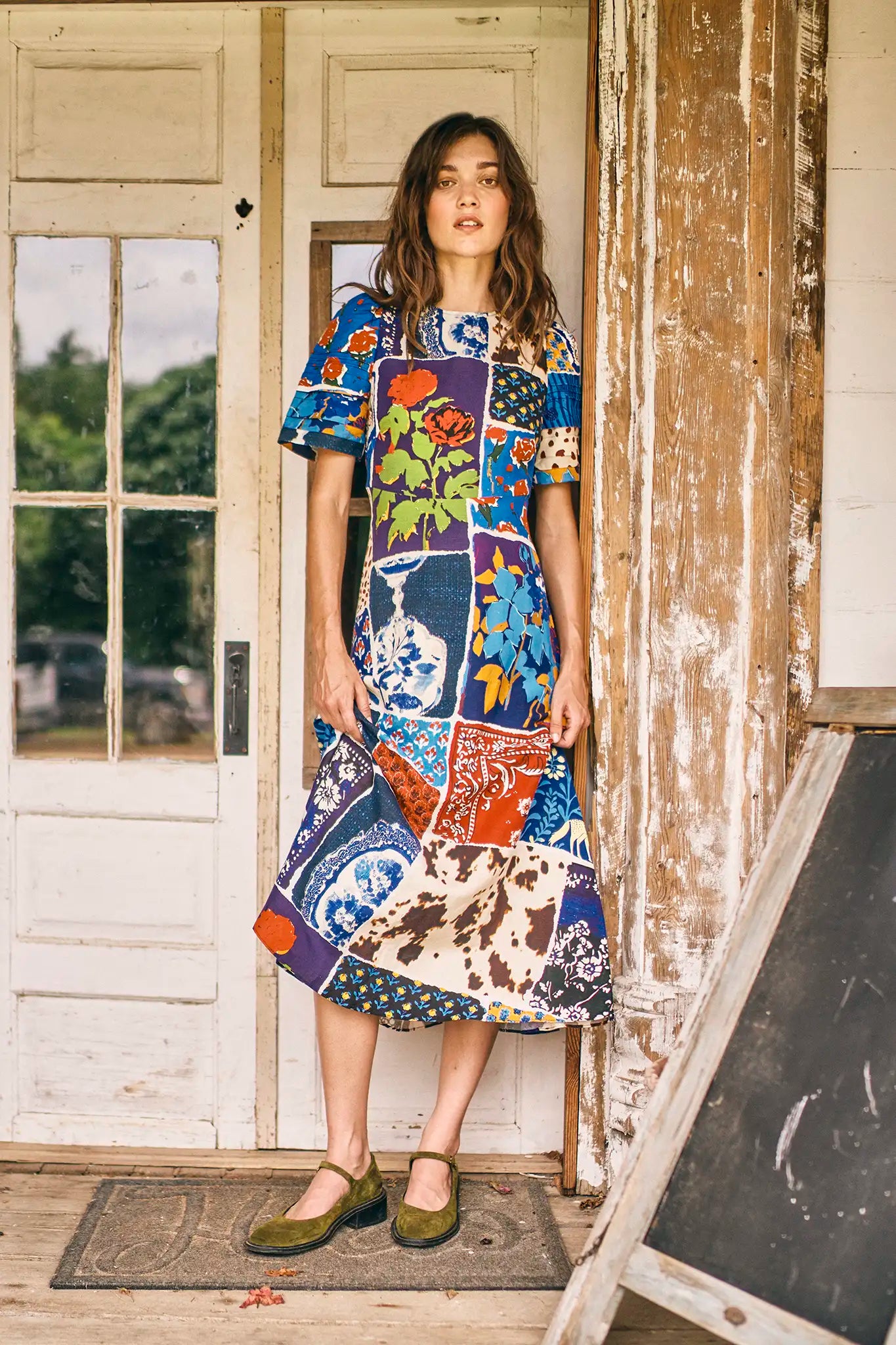 The Casey Dress is a sheath midi with a curved waist seam, relaxed skirt and pleated short sleeves.