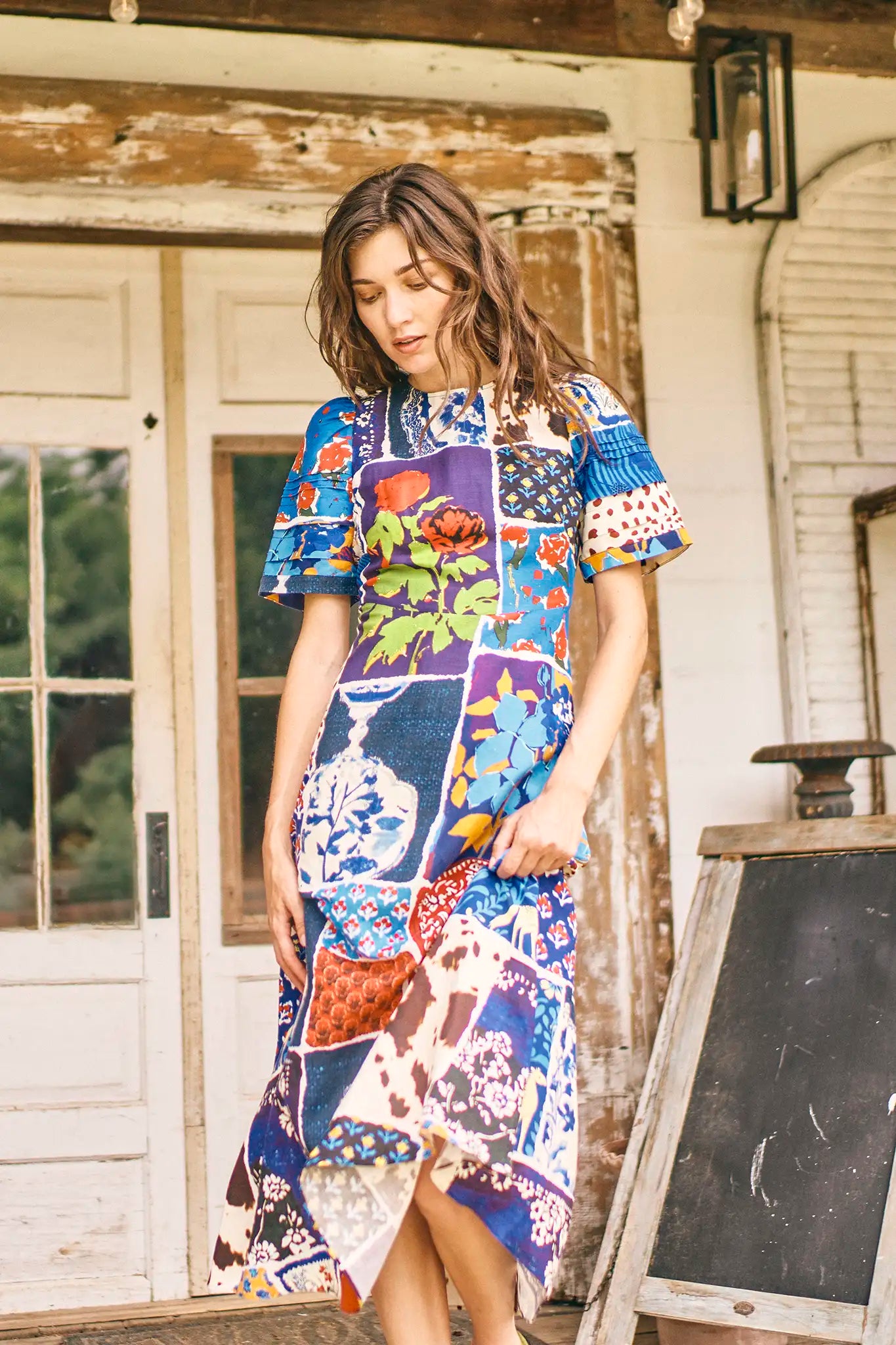 The Casey Dress is a sheath midi with a curved waist seam, relaxed skirt and pleated short sleeves.