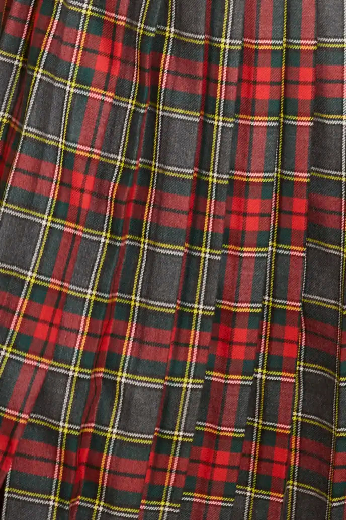 The Dominic Skirt has a banded waist and a straight pleated silhouette finished with front slits.