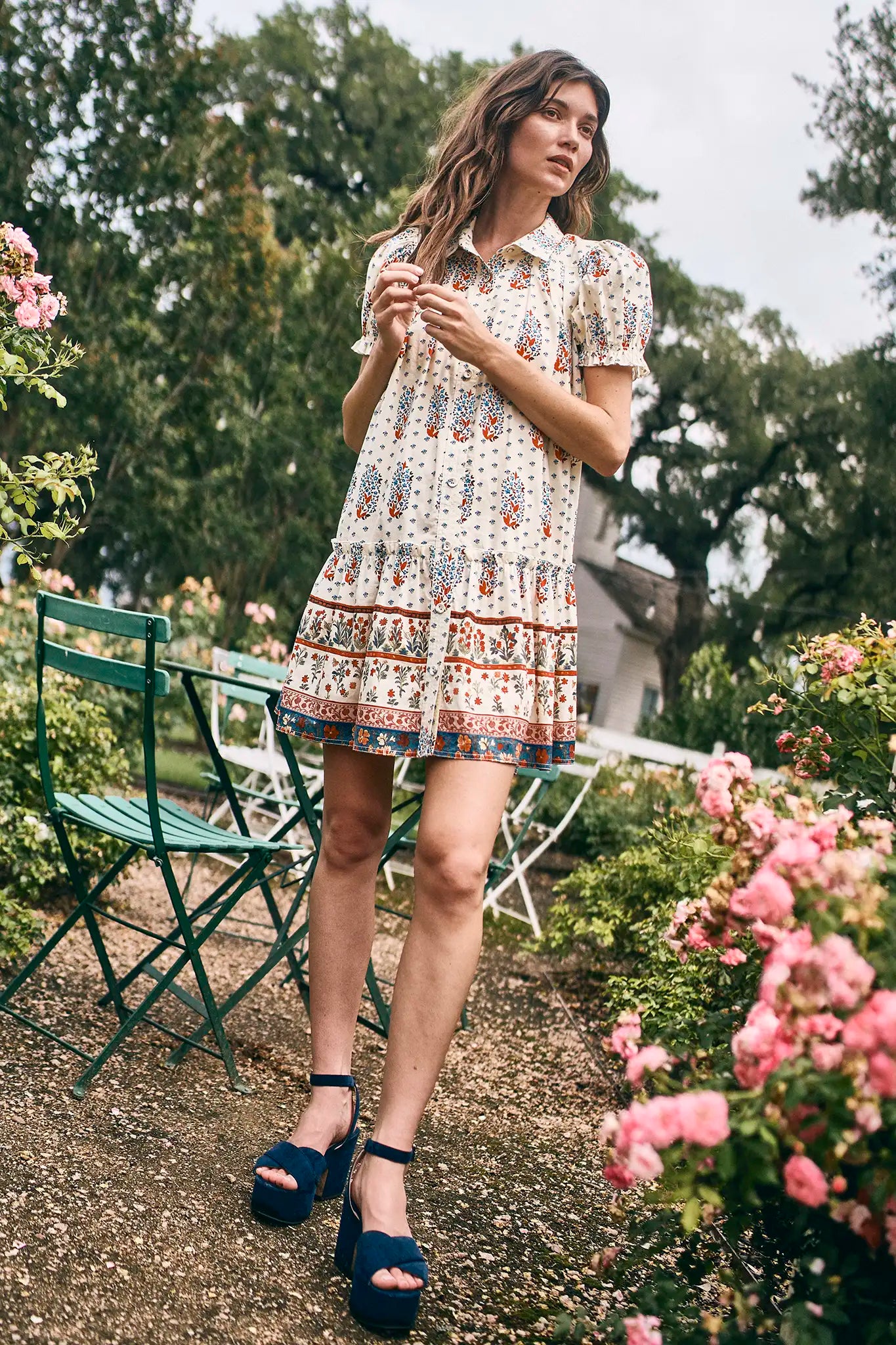 The Drifter Mini has a collared neckline, short puff sleeves, a drop waist and flounce hem.