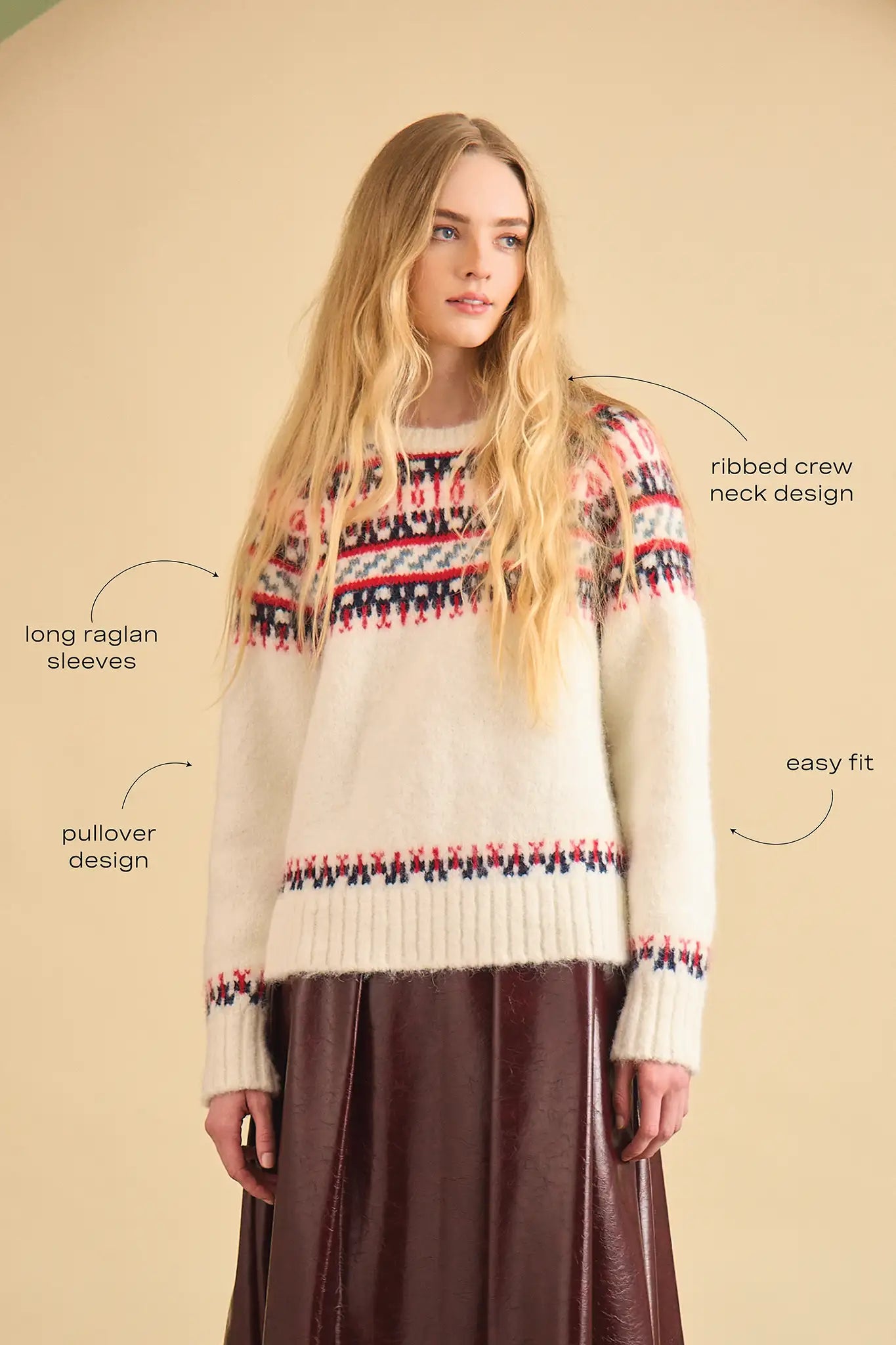 The Josie Sweater in Cream Fairisle has a ribbed crew neckline and long raglan sleeves.