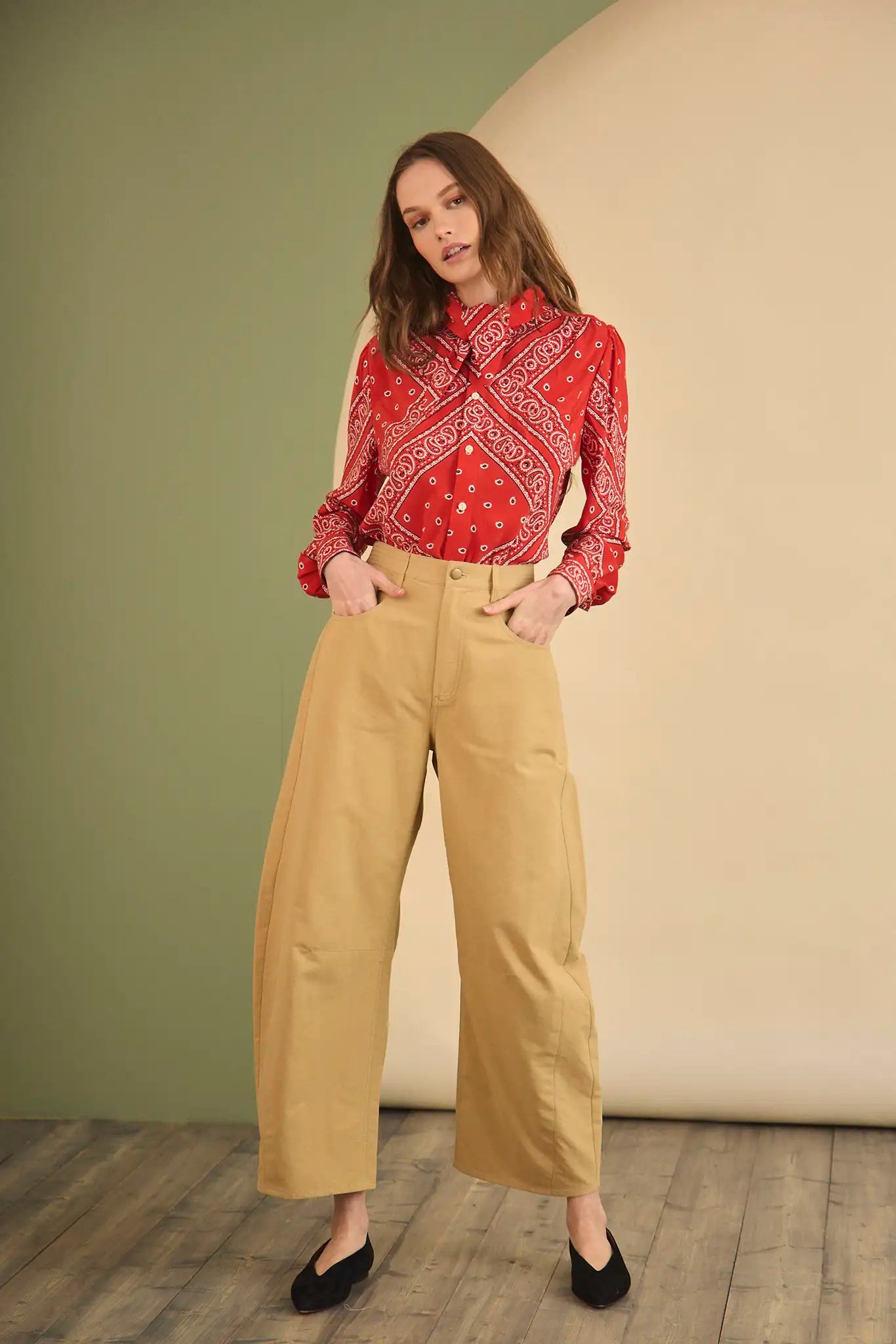 The Frances Top has a button front, long sleeves, button cuffs and a scarf collar detail.