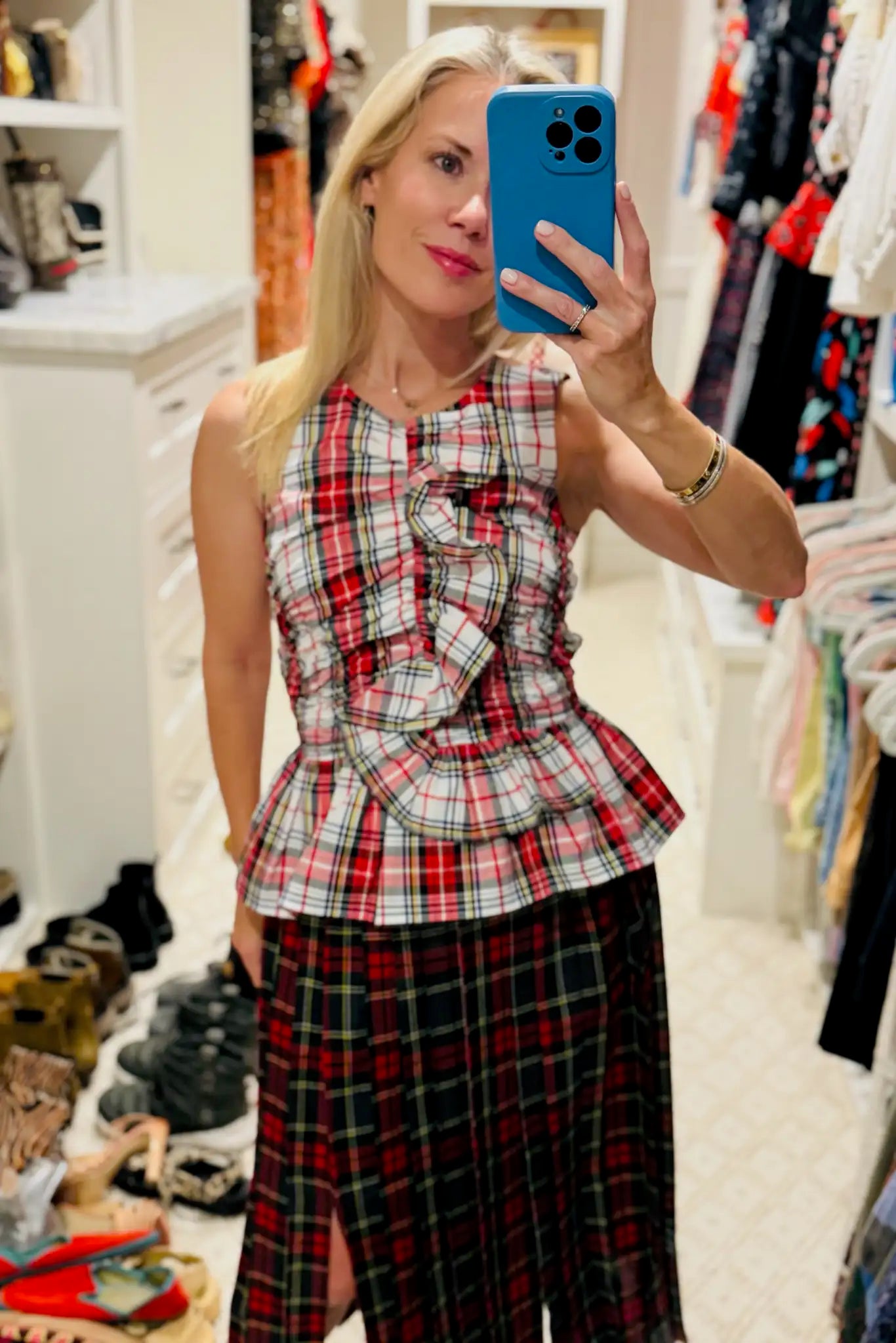 The Doering Top is a fitted V-neck silhouette with ruffles, shirring, and a peplum waist.