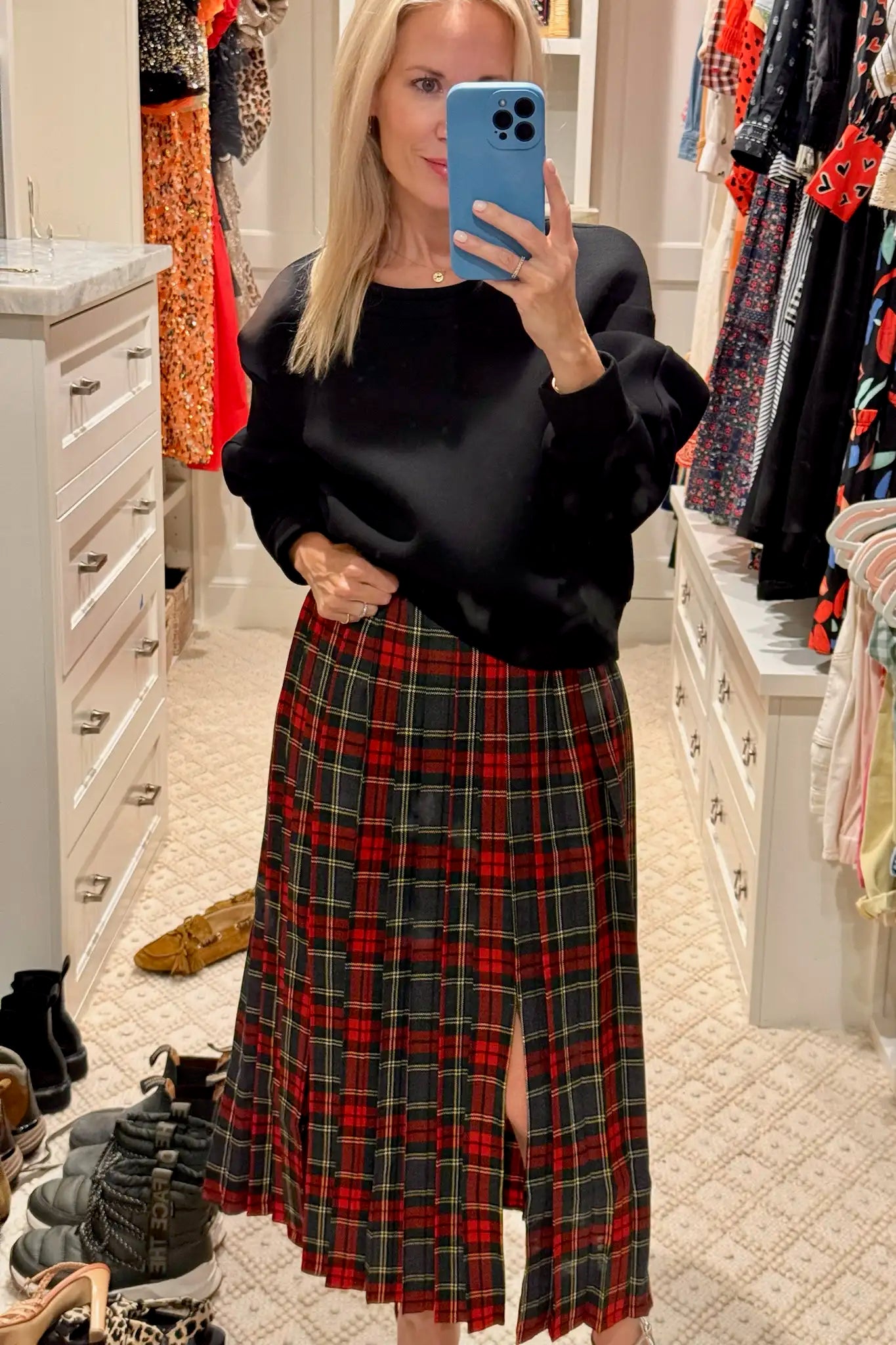 The Dominic Skirt has a banded waist and a straight pleated silhouette finished with front slits.