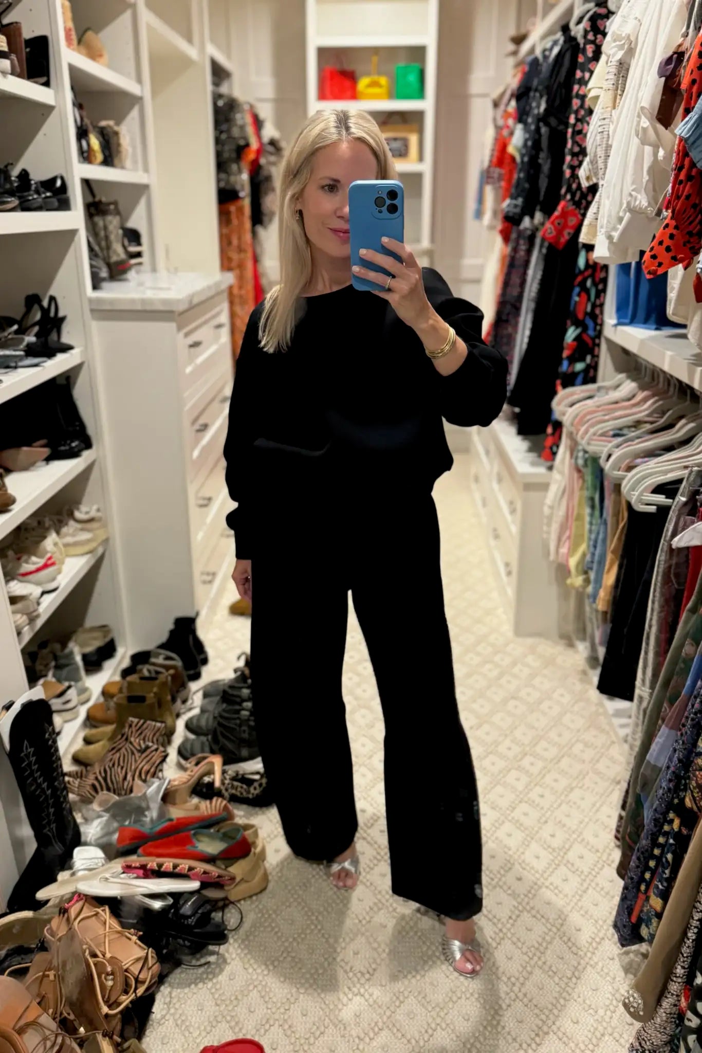 The Jennie Sweatshirt is a structured scuba in deep Onyx with pleated long sleeves.