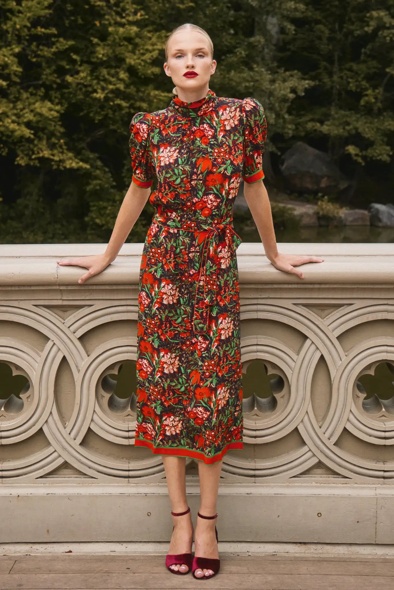 The Langley Dress is designed with a mock neck, puff sleeves, and an optional self-tie belt.