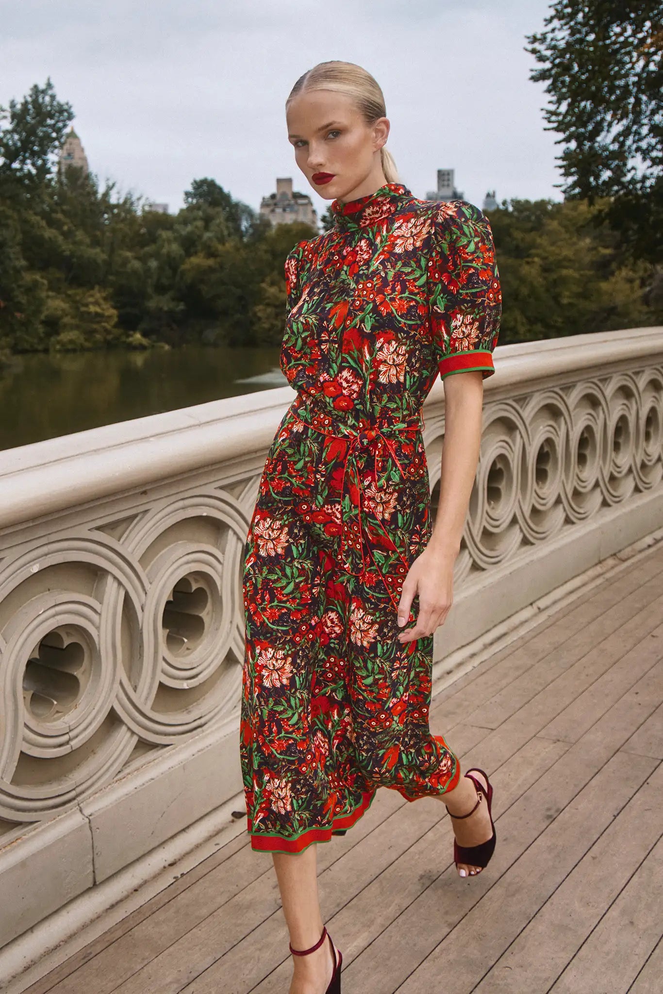 The Langley Dress is designed with a mock neck, puff sleeves, and an optional self-tie belt.