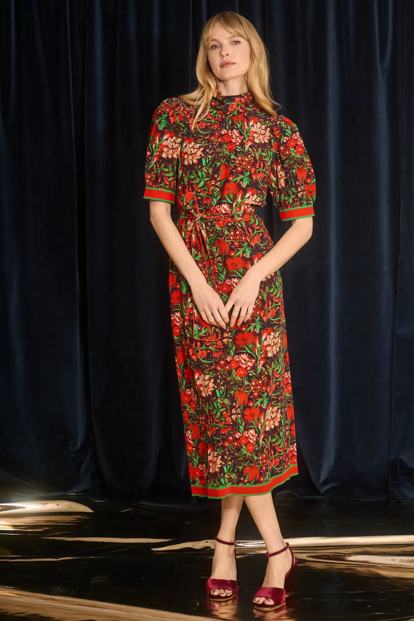 The Langley Dress is designed with a mock neck, puff sleeves, and an optional self-tie belt.