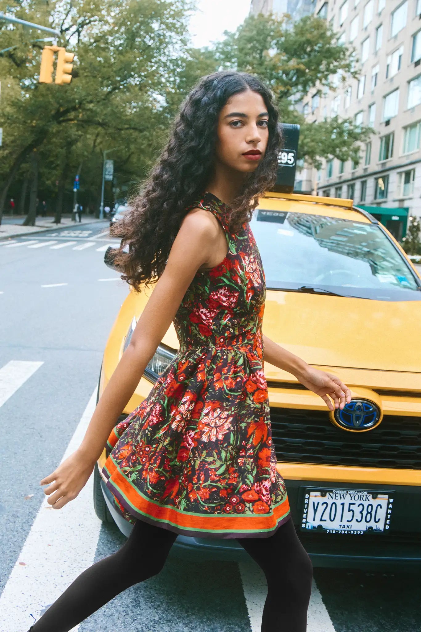 The Layne Dress is a sleeveless mini dress with a fit and flare style in our holiday floral print.