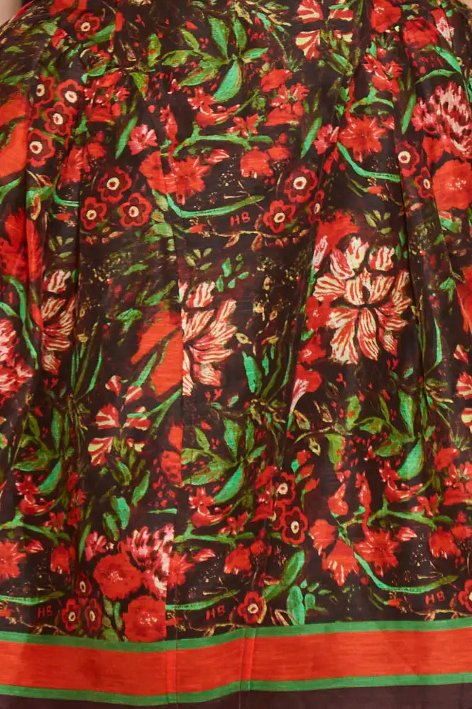 The Layne Dress is a sleeveless mini dress with a fit and flare style in our holiday floral print.