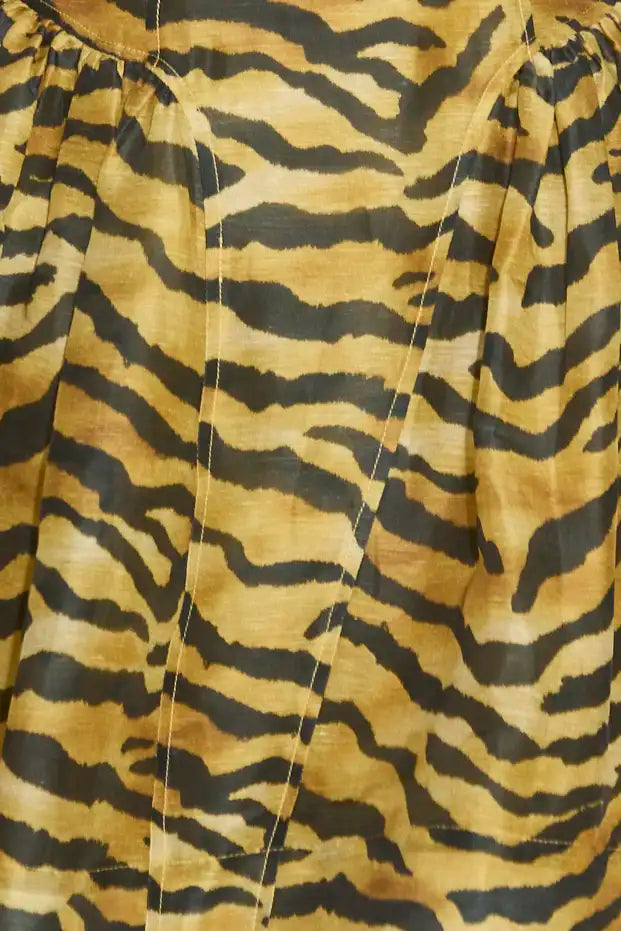 The Layne Dress is a sleeveless mini dress with a fit and flare style in our tiger print.