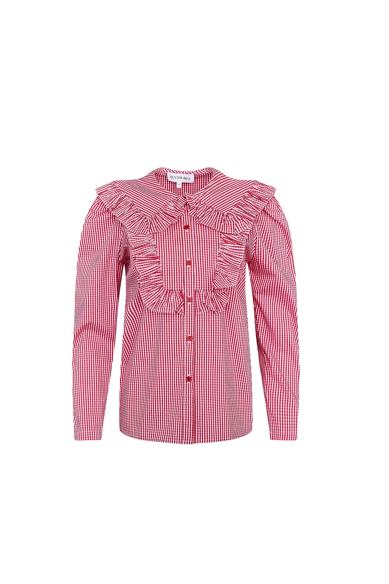 The Mae Top has a collared button front shape, ruffled yokes, and long sleeves with button cuffs.