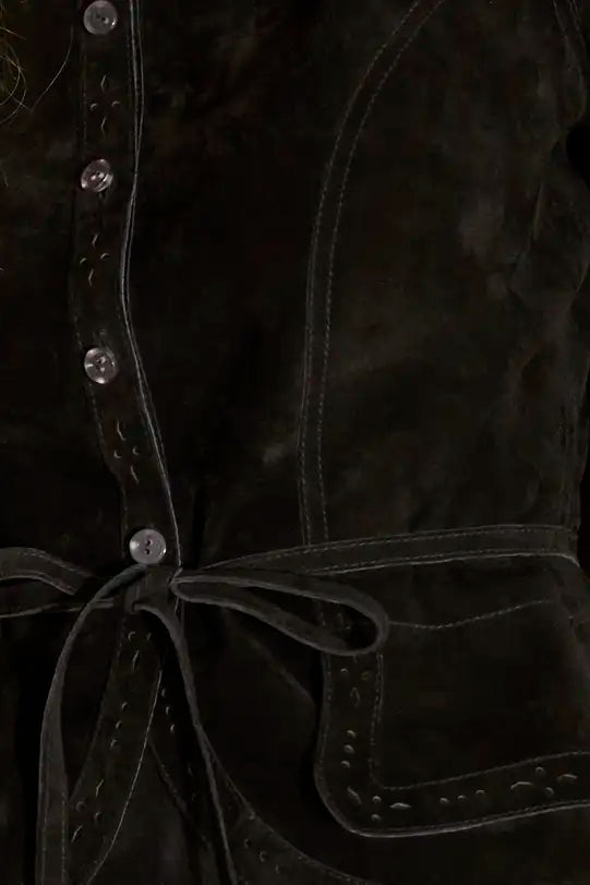 The Murphey Jacket has a button front, long sleeves with button cuffs, and a waist cinched by a belt