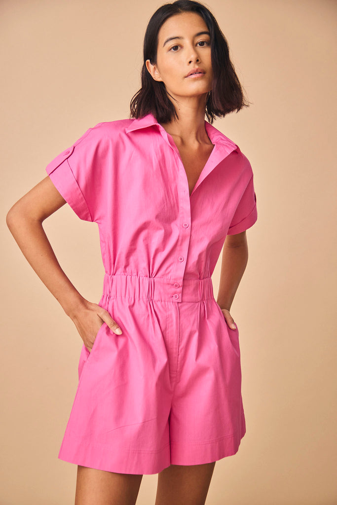 The Reed Jumpsuit has short sleeves with banded cuffs, on seam pockets, and zipper fly shorts.