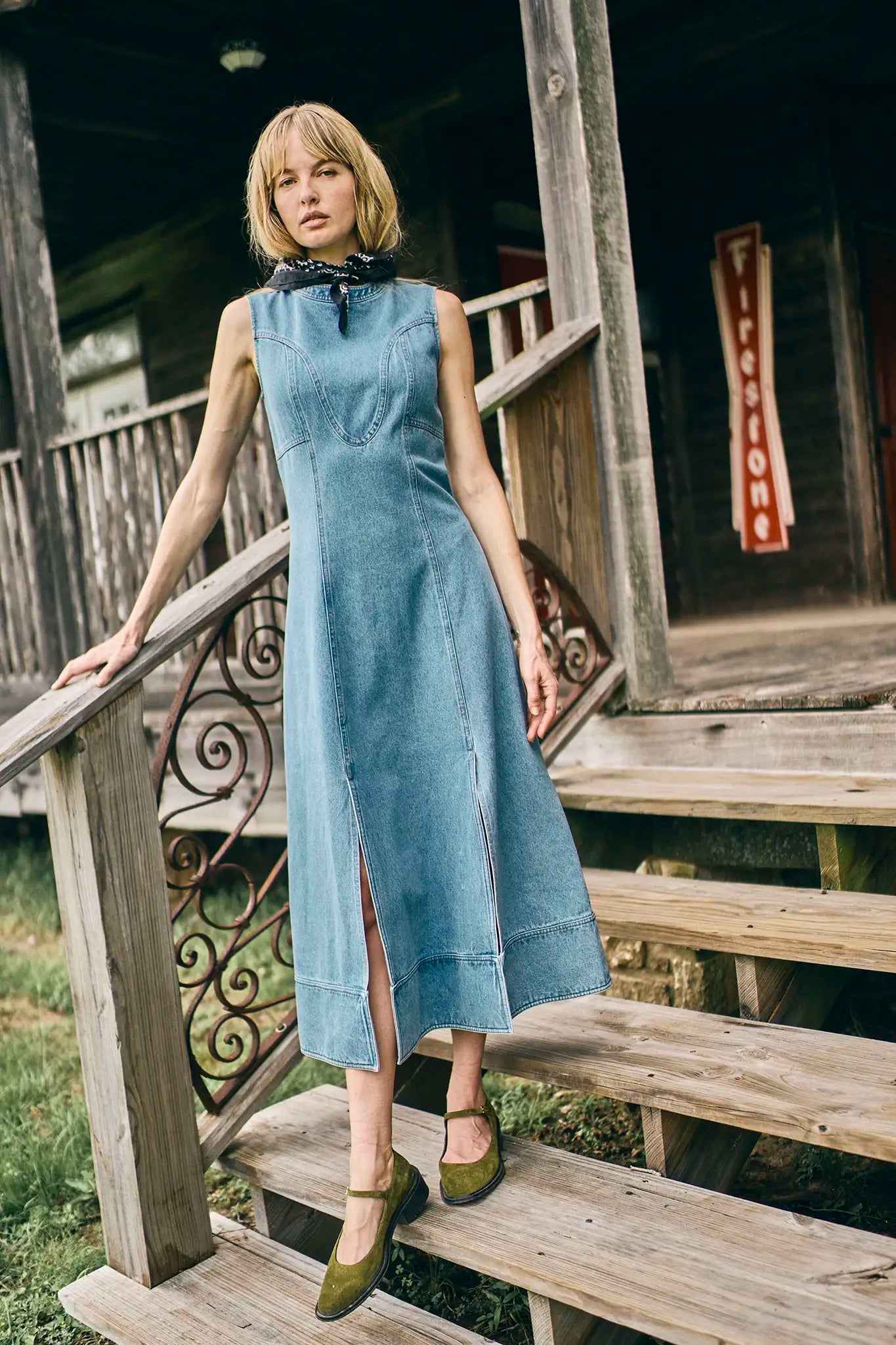 The Sedona Dress has a sleeveless crew neck, detailed seaming, a fitted bodice, and kick pleats.