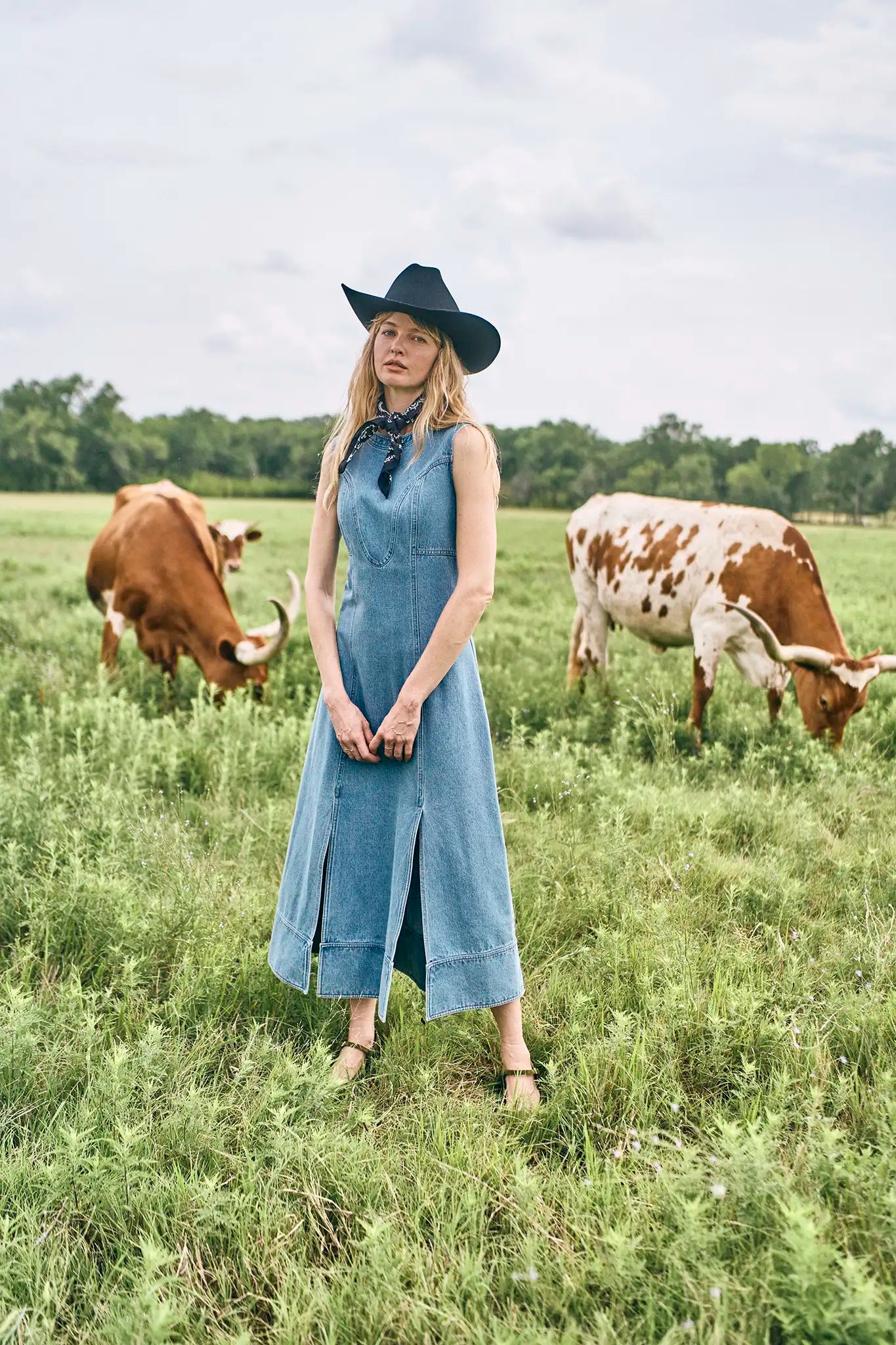 The Sedona Dress has a sleeveless crew neck, detailed seaming, a fitted bodice, and kick pleats.