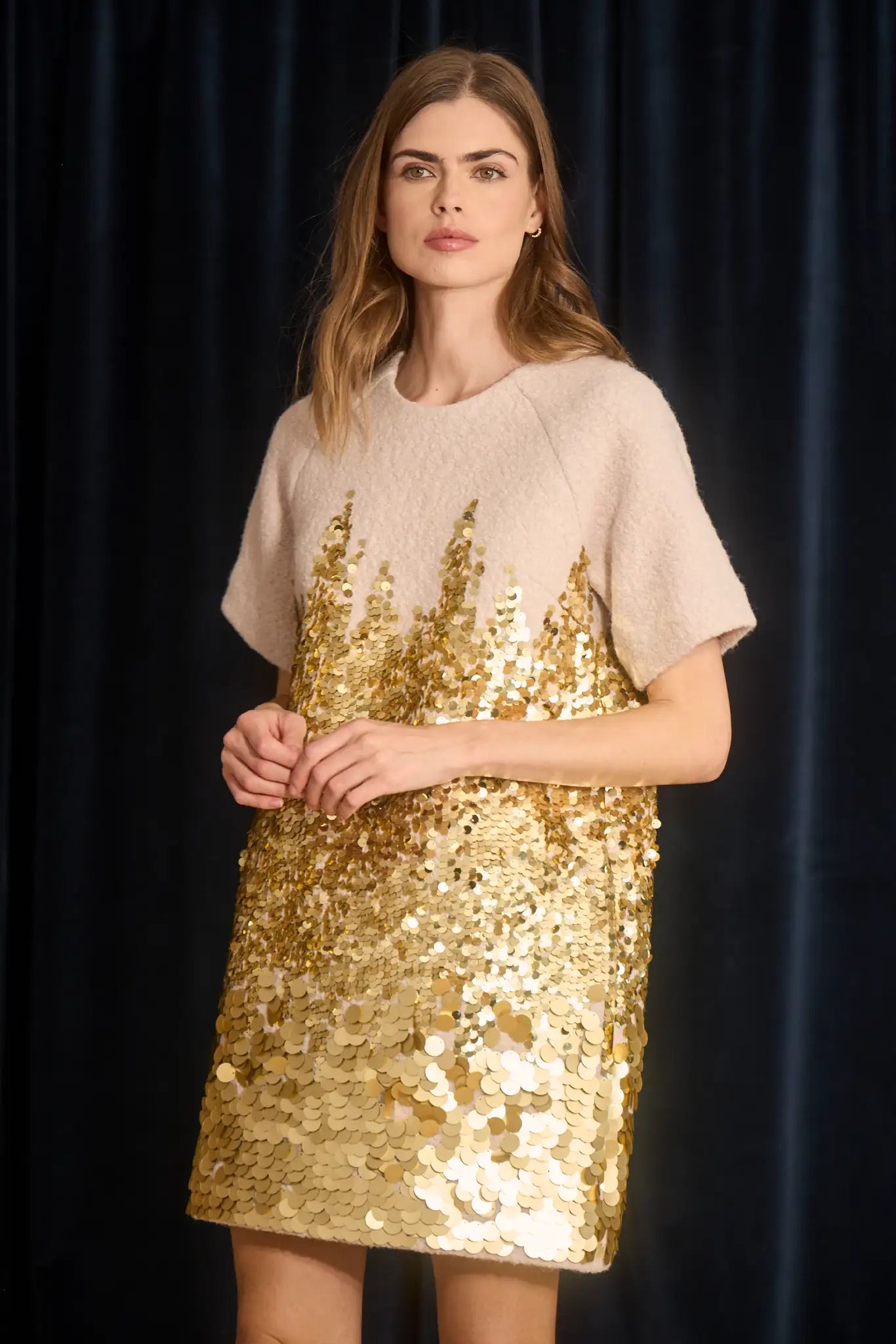 The Aerin Dress is crafted from Italian wool embroidered with cascading gold paillettes.