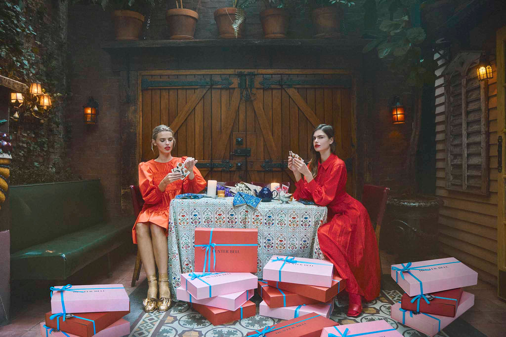 Arley Dress and Tenley Dress in red alert with the holiday gift boxes.