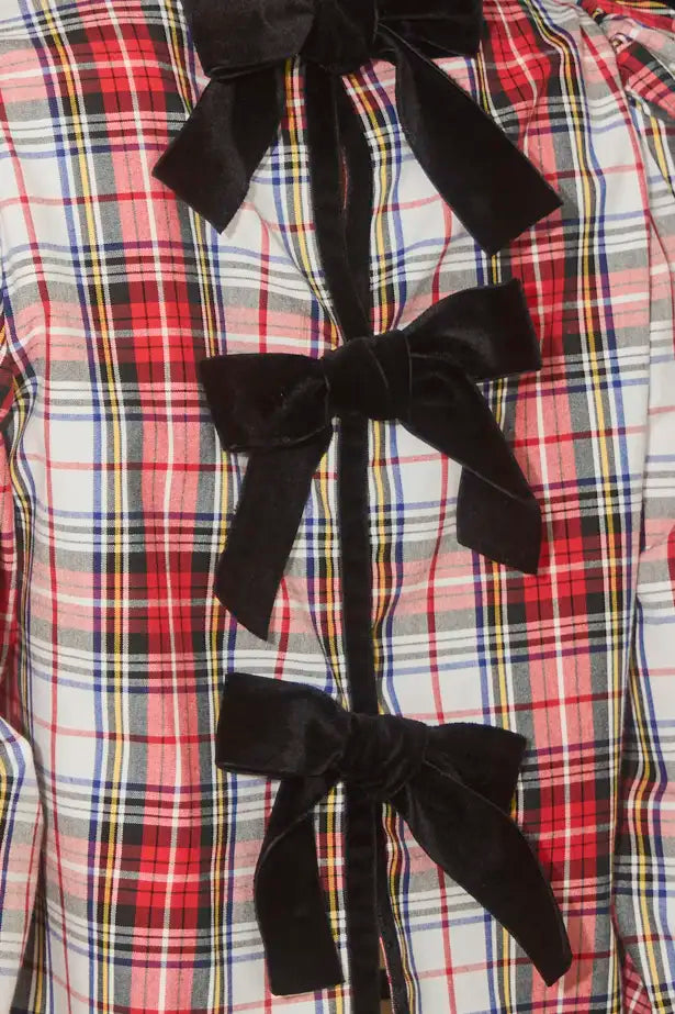 The Lottie Top has a crew neckline, black velvet ribbon ties, balloon sleeves with tailored cuffs.