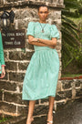 The Scarlet Dress in Saltwater paired with silver shoes.