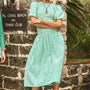 The Scarlet Dress in Saltwater paired with silver shoes.