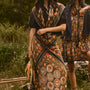 The Mare Top in Onyx paired with the Suki Skirt in Found Heirloom and the matching scarf.