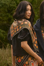 The Mare Top in Onyx paired with the Suki Skirt in Found Heirloom and matching scarf. 