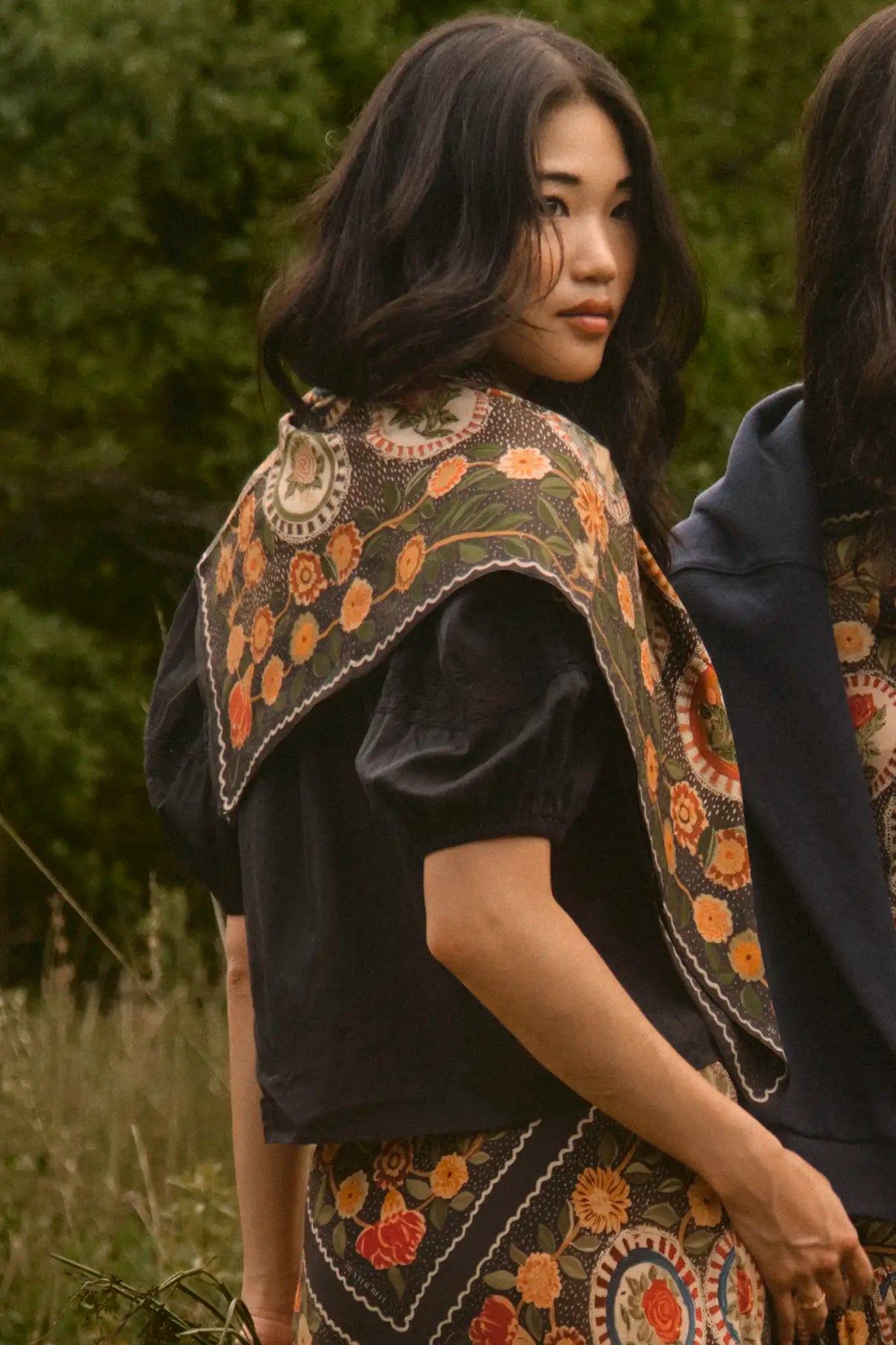 The Mare Top in Onyx paired with the Suki Skirt in Found Heirloom and matching scarf. 