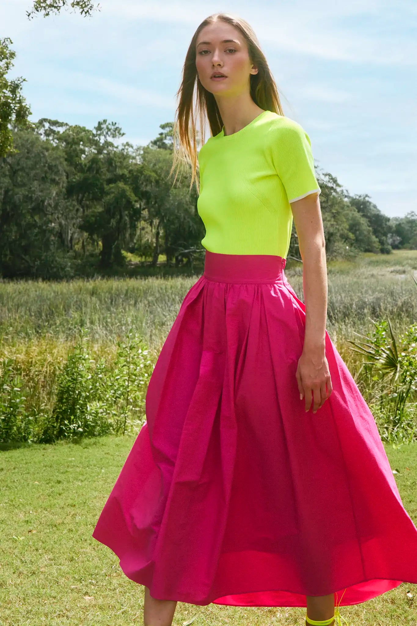 A fitted sweater-knit tee in vibrant neon yellow with a classic crew neckline and short sleeves.