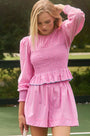 The Eubanks Top in Watermelon Stripe has a fitted bodice, puff sleeves, and smocked cuffs