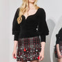 The Abrams Top in Velvet Onyx paired with the Britt Mini Skirt in Parlour Plaid Garnet. 