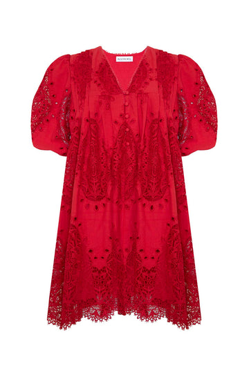 The Alden Dress in scarlet lace has a v-neckline, elbow-length puff sleeves, and a pull-over design.