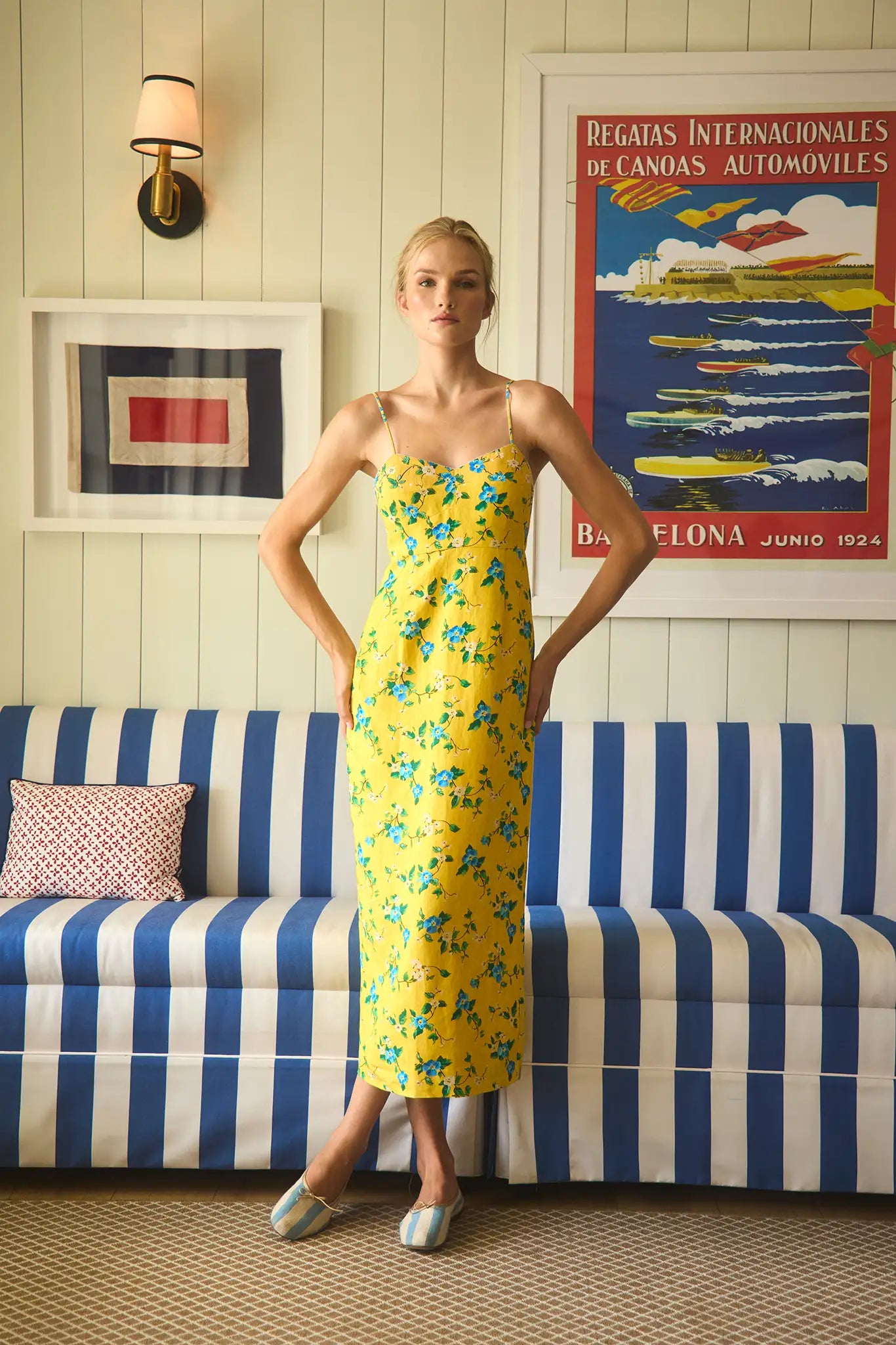 The Amal Dress in Middleton Meadow on model in front of red backdrop.