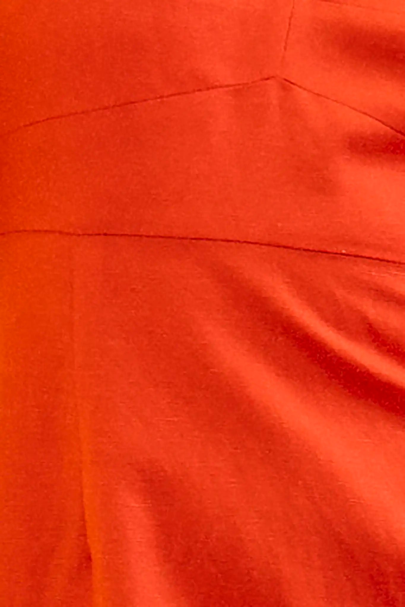 Close up of the Amal Dress in tangerine tango, spaghetti strap midi with subtle bust