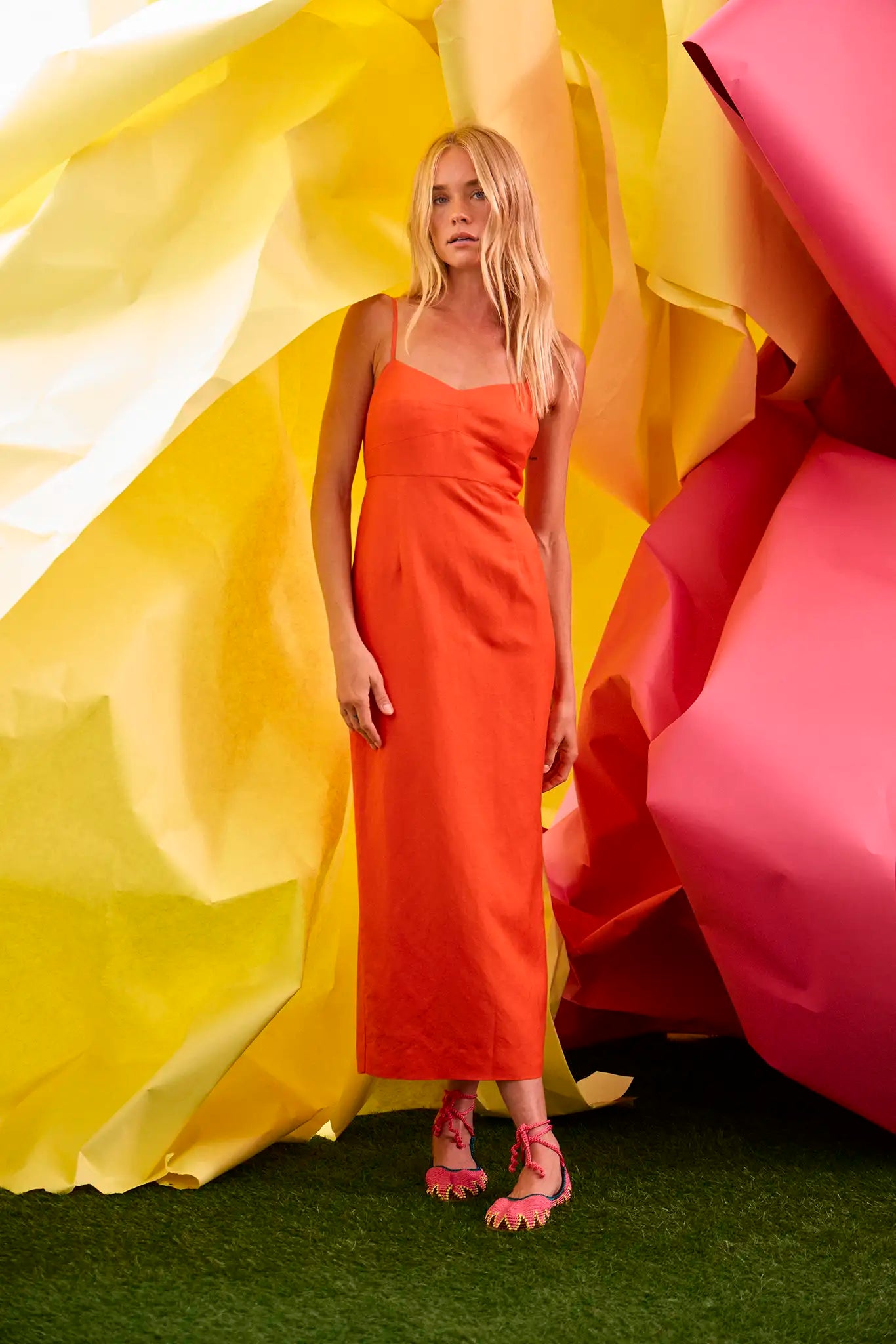 The Amal Dress in tangerine tango, spaghetti strap midi with subtle bust and sleek pencil skirt.
