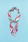 The Anniversary Scarf in our anniversary print tied in knot
