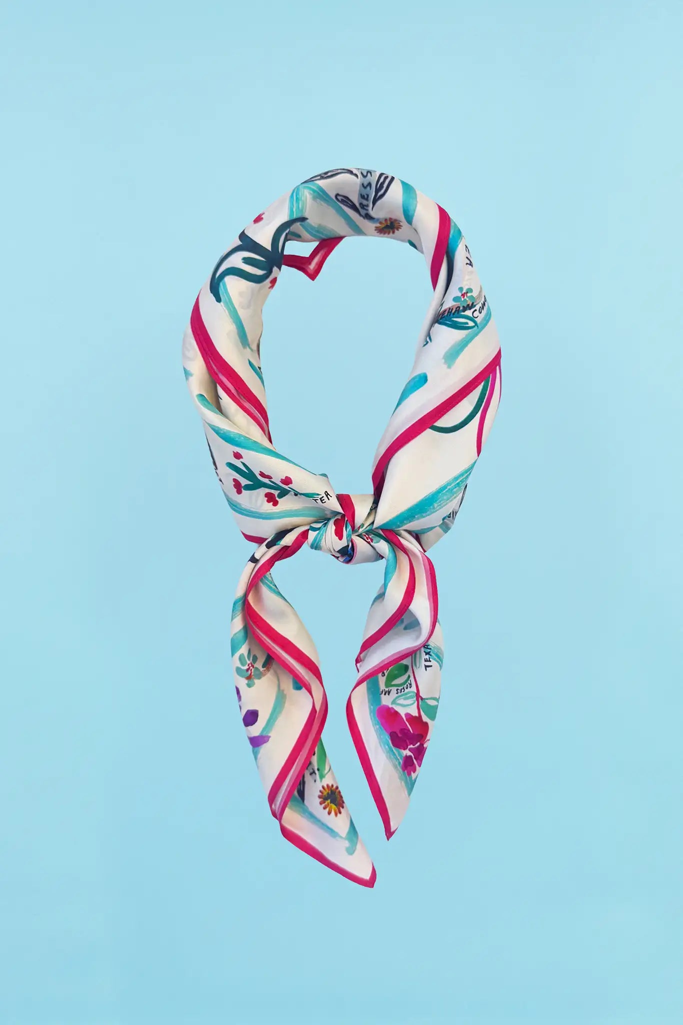 The Anniversary Scarf in our anniversary print tied in knot