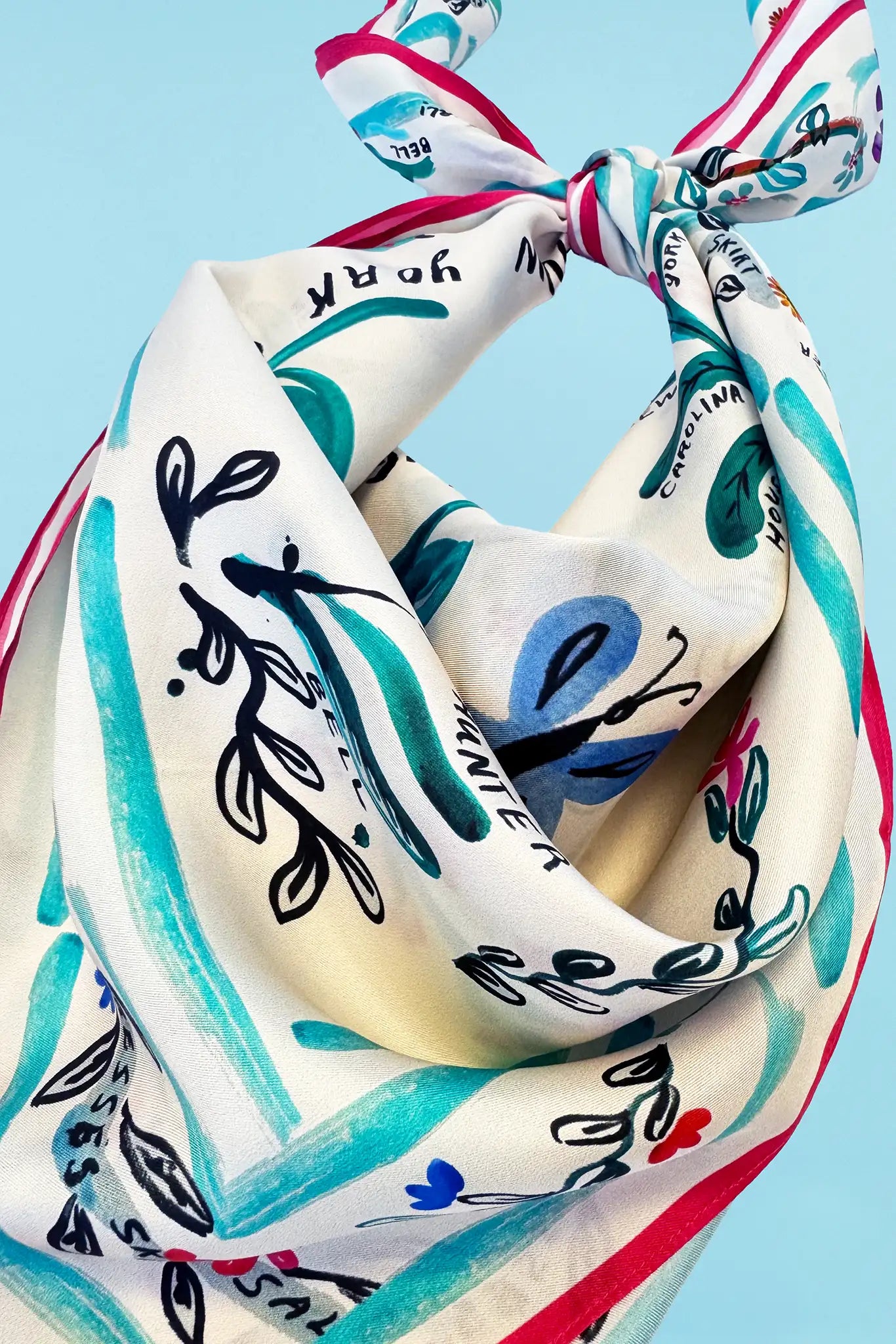 The Anniversary Scarf in our anniversary print tied in knot