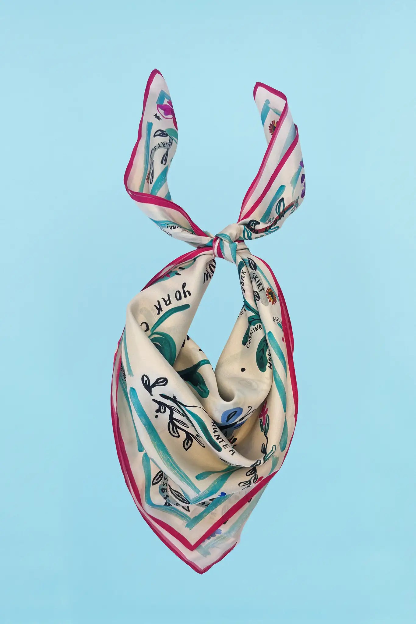 The Anniversary Scarf in our anniversary print tied in knot