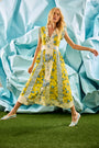 The April Dress in Middleton Meadow Mix with V-Neck, short banded sleeves, and flowing skirt.