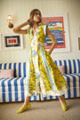 The April Dress in Middleton Meadow Mix with V-Neck, short banded sleeves, and flowing skirt.