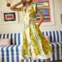 The April Dress in Middleton Meadow Mix with V-Neck, short banded sleeves, and flowing skirt.