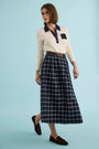 The Archie Polo paired wth the Queenby Skirt in St. Andrews Check. 
