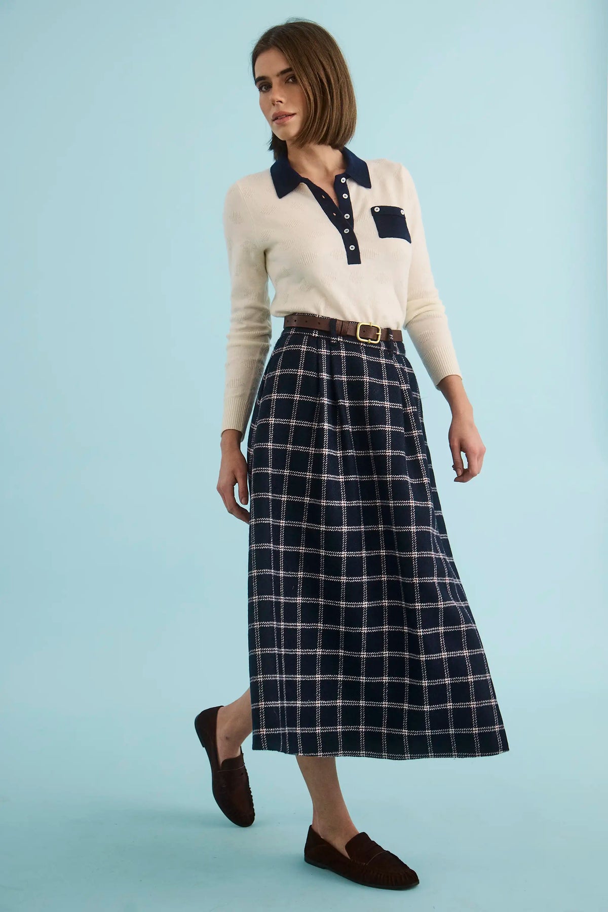 The Archie Polo paired wth the Queenby Skirt in St. Andrews Check. 