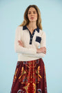 The Archie Polo paired wth the Wimberly Skirt in Birds of a Feather Maroon. 